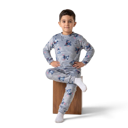 Twinkles grey Stitch print fleece pajama set worn by a young boy sitting on a wooden block